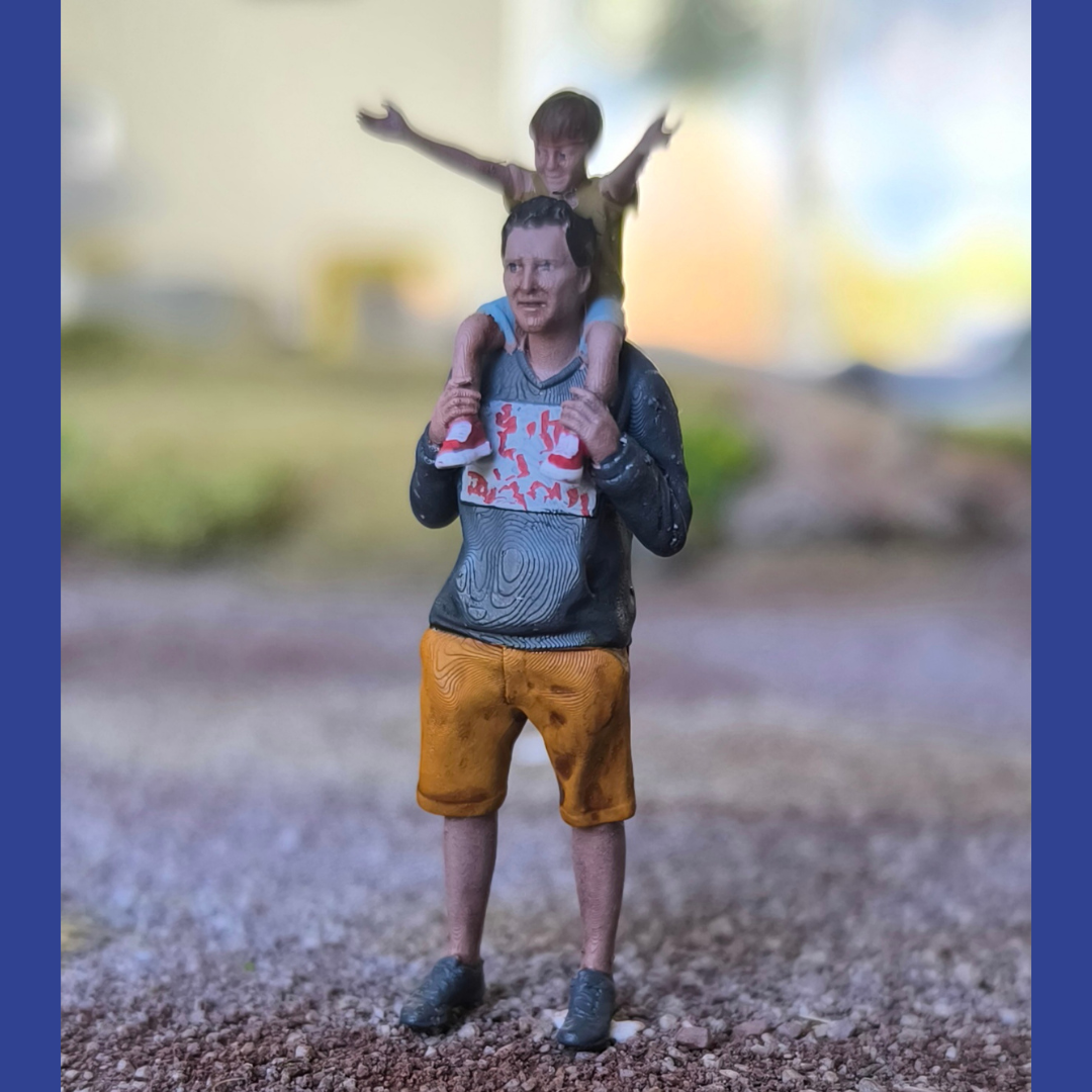 Fils sur les épaules de son père